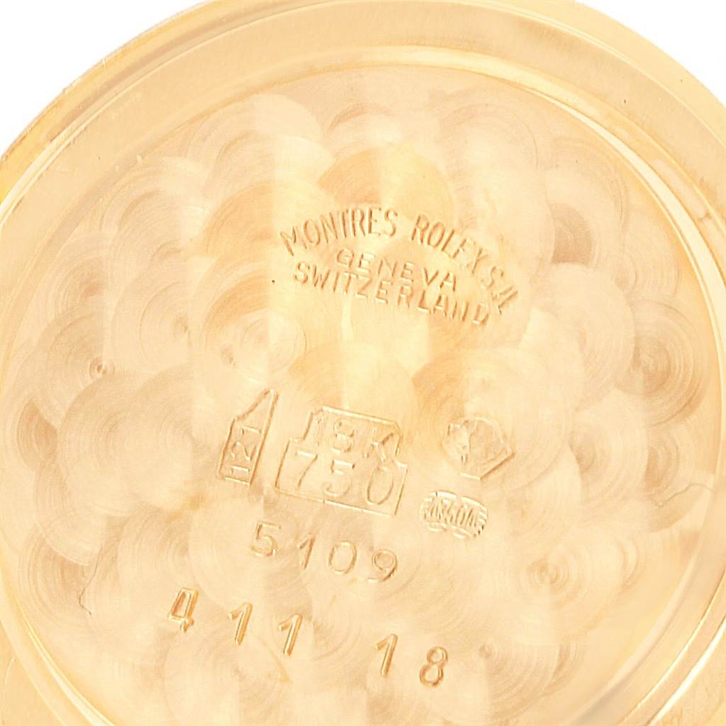 The image shows the inside case back of a Rolex Cellini 5109 Women's Yellow Gold Mother of Pearl Dial 5109 Women's Yellow Gold Mother of Pearl Dial watch, highlighting various engravings and hallmarks.