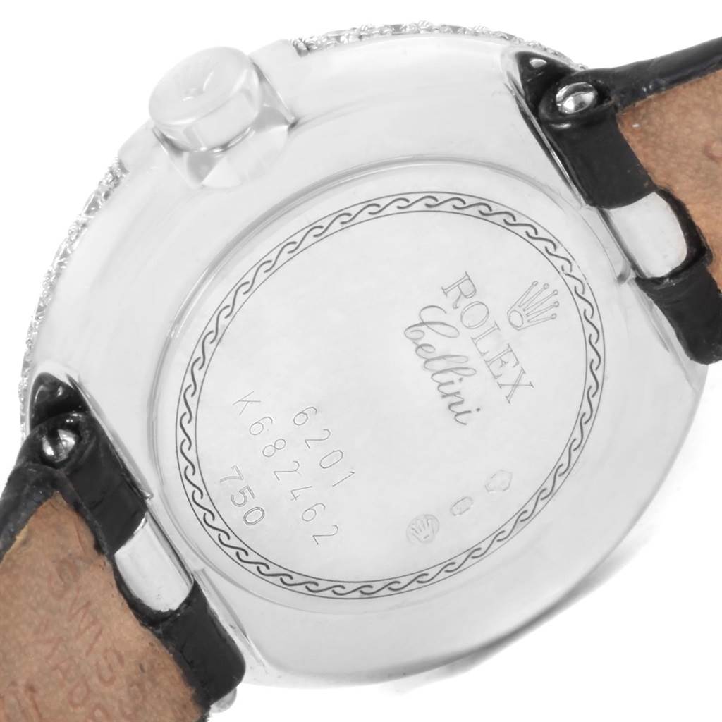 The image shows the back case of a Rolex Cellini 6201 Women's White Gold Mother of Pearl Dial 6201 Women's White Gold Mother of Pearl Dial watch, displaying the engraved details and leather straps.
