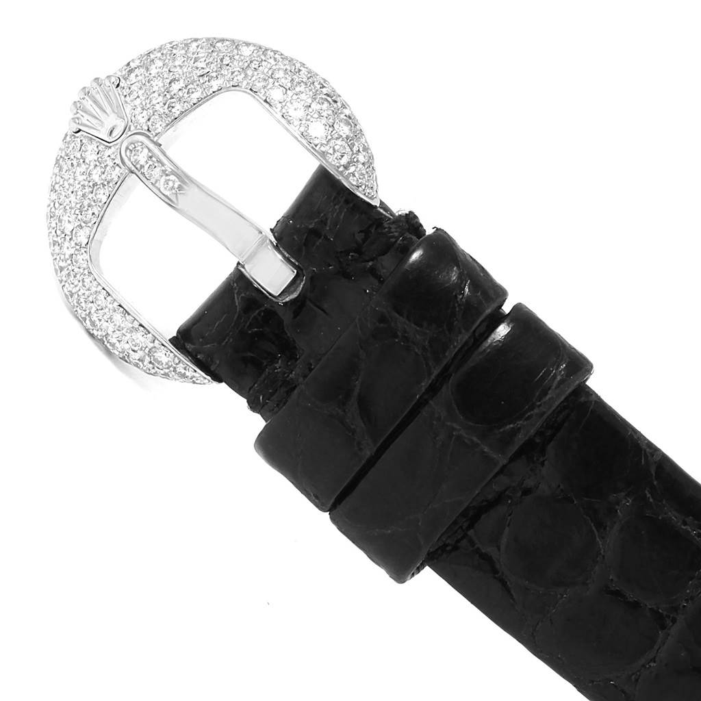 The image shows the buckle and part of the black leather strap of a Rolex Cellini 6201 Women's White Gold Mother of Pearl Dial 6201 Women's White Gold Mother of Pearl Dial watch.