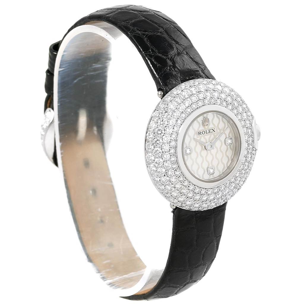 The image shows a Rolex Cellini 6201 Women's White Gold Mother of Pearl Dial 6201 Women's White Gold Mother of Pearl Dial watch at a three-quarter angle showcasing its watch face, diamond bezel, and black strap.