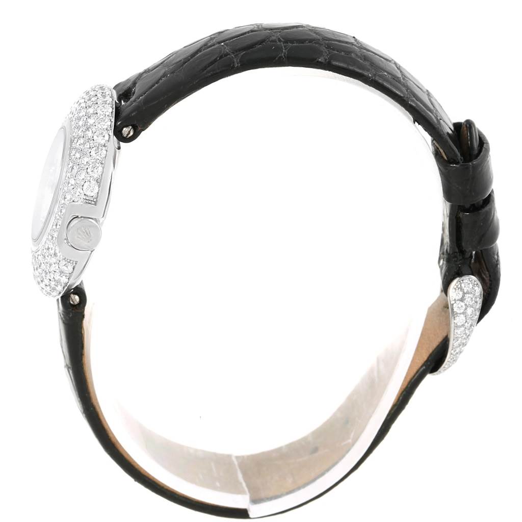 The image shows a side view of a Rolex Cellini 6201 Women's White Gold Mother of Pearl Dial 6201 Women's White Gold Mother of Pearl Dial watch, highlighting its black leather strap and diamond-encrusted bezel.