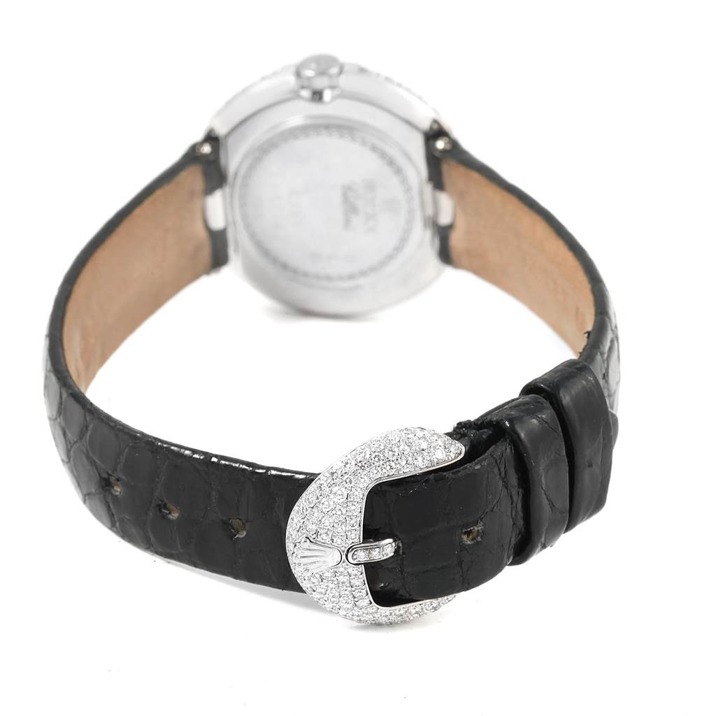 The image shows the back side of a Rolex Cellini 6201 Women's White Gold Mother of Pearl Dial 6201 Women's White Gold Mother of Pearl Dial watch, highlighting its black leather strap and diamond-encrusted buckle.