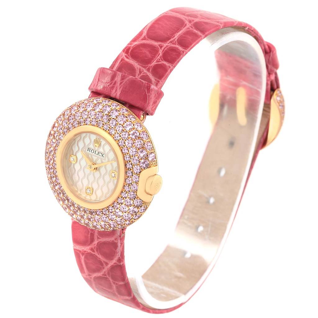 The image shows a Rolex Cellini 6201 Women's Yellow Gold Mother of Pearl Dial 6201 Women's Yellow Gold Mother of Pearl Dial watch from a front angle, highlighting its pink leather strap, gold case, and diamond-encrusted bezel.