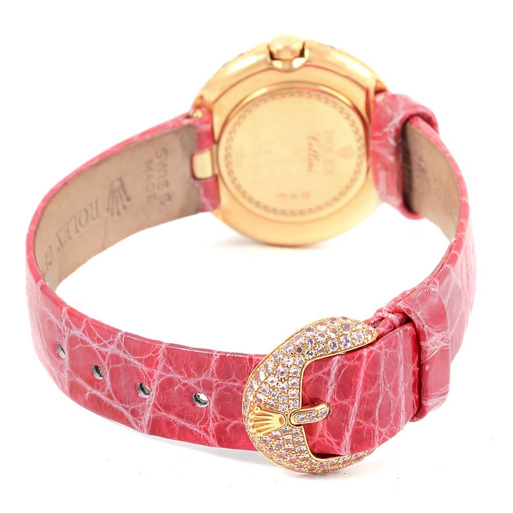 The image shows the back view of a Rolex Cellini 6201 Women's Yellow Gold Mother of Pearl Dial 6201 Women's Yellow Gold Mother of Pearl Dial watch, highlighting its pink leather strap and gold, jewel-encrusted buckle.