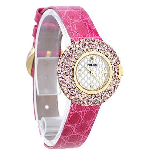 The image shows a Rolex Cellini 6201 Women's Yellow Gold Mother of Pearl Dial 6201 Women's Yellow Gold Mother of Pearl Dial watch at a slight angle, highlighting its pink strap and diamond-encrusted bezel.