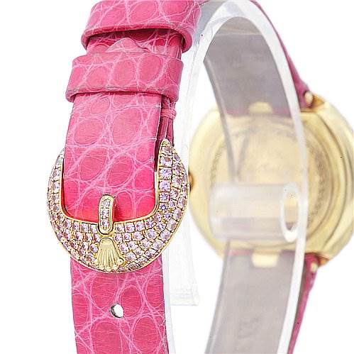This image shows a close-up of the buckle of a Rolex Cellini 6201 Women's Yellow Gold Mother of Pearl Dial 6201 Women's Yellow Gold Mother of Pearl Dial watch with a pink leather strap and diamond accents.