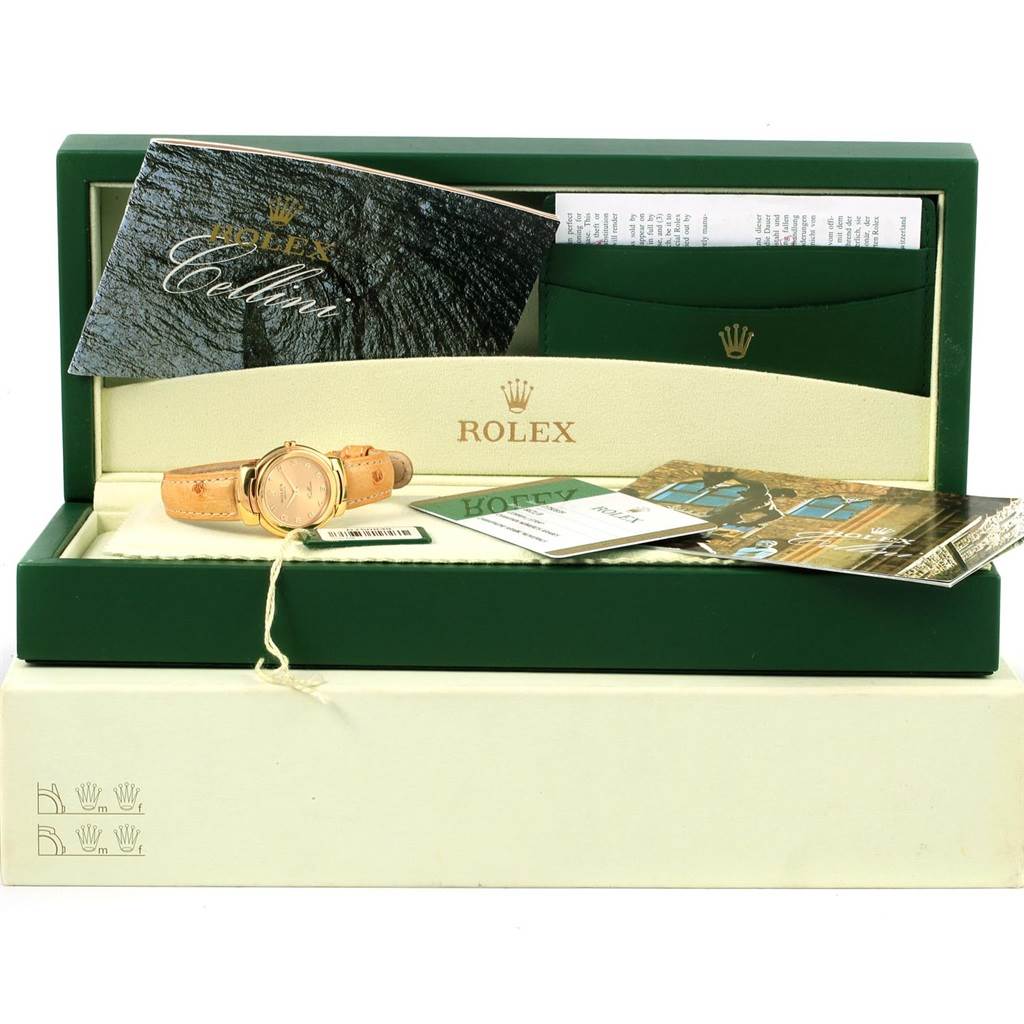 The image shows a Rolex Cellini 6621 Women's Yellow Gold Champagne Dial 6621 Women's Yellow Gold Champagne Dial watch in its box, along with booklets and paperwork.