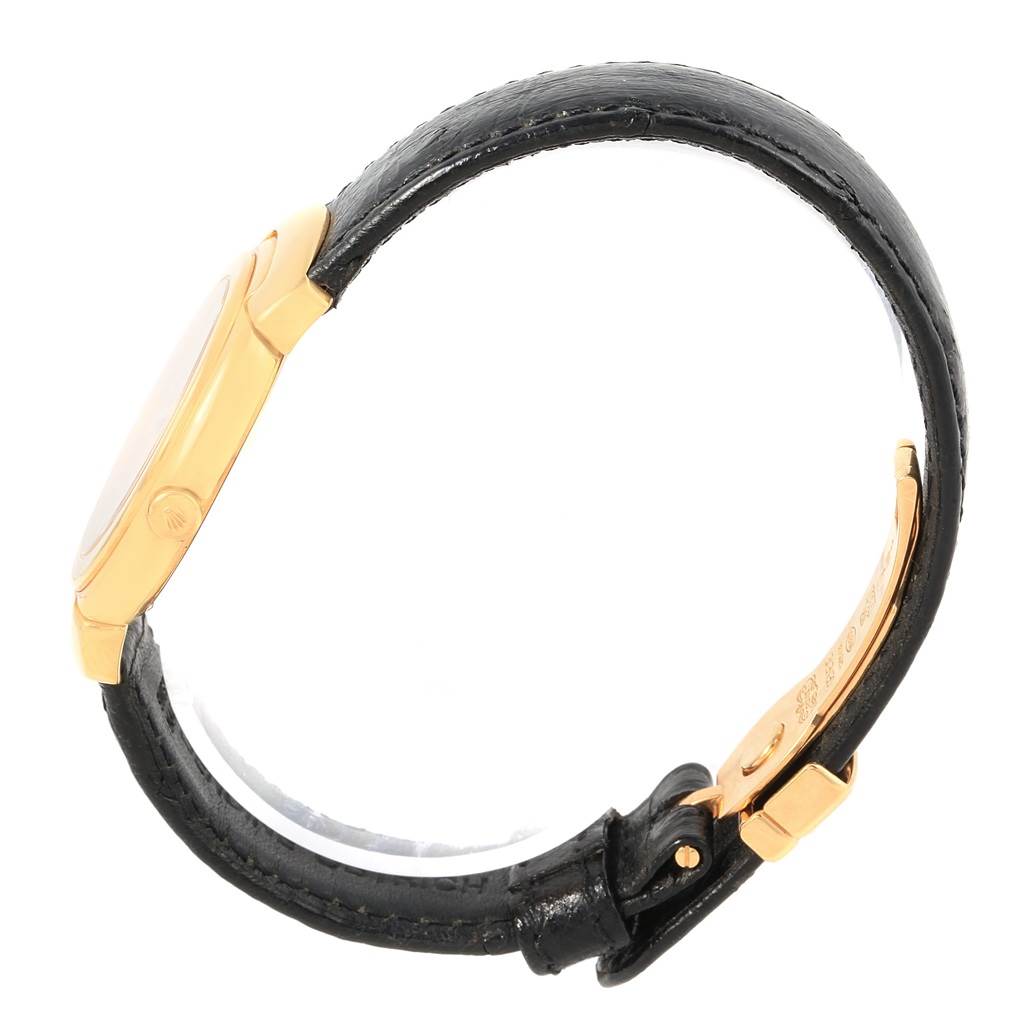 This image shows a side view of the Rolex Cellini 6622 Women's Yellow Gold Champagne Dial 6622 Women's Yellow Gold Champagne Dial watch, highlighting its gold case and black leather strap with a clasp.