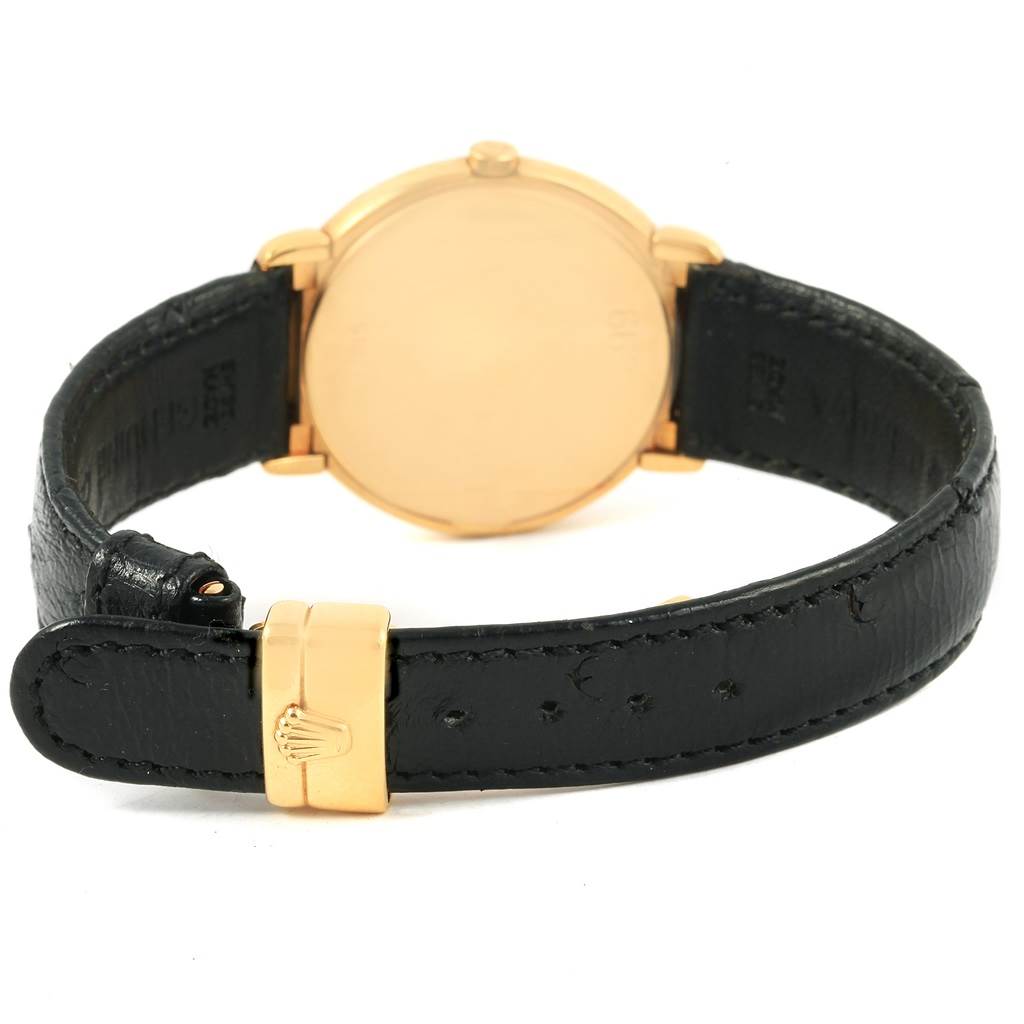 The image shows the back of a Rolex Cellini 6622 Women's Yellow Gold Champagne Dial 6622 Women's Yellow Gold Champagne Dial watch, highlighting its leather strap and gold clasp.