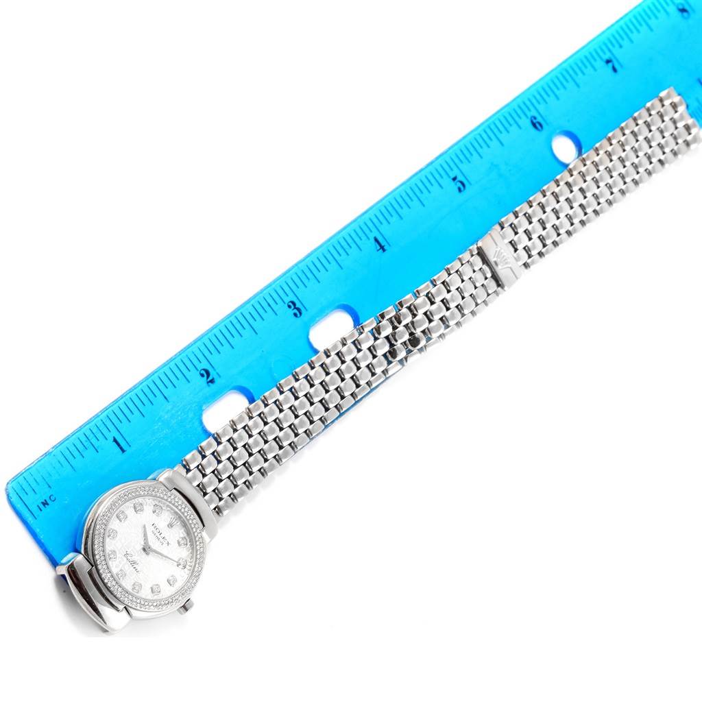 The image shows the Rolex Cellini 6671 Women's White Gold Silver Dial 6671 Women's White Gold Silver Dial watch lying flat next to a ruler, highlighting the face and bracelet.