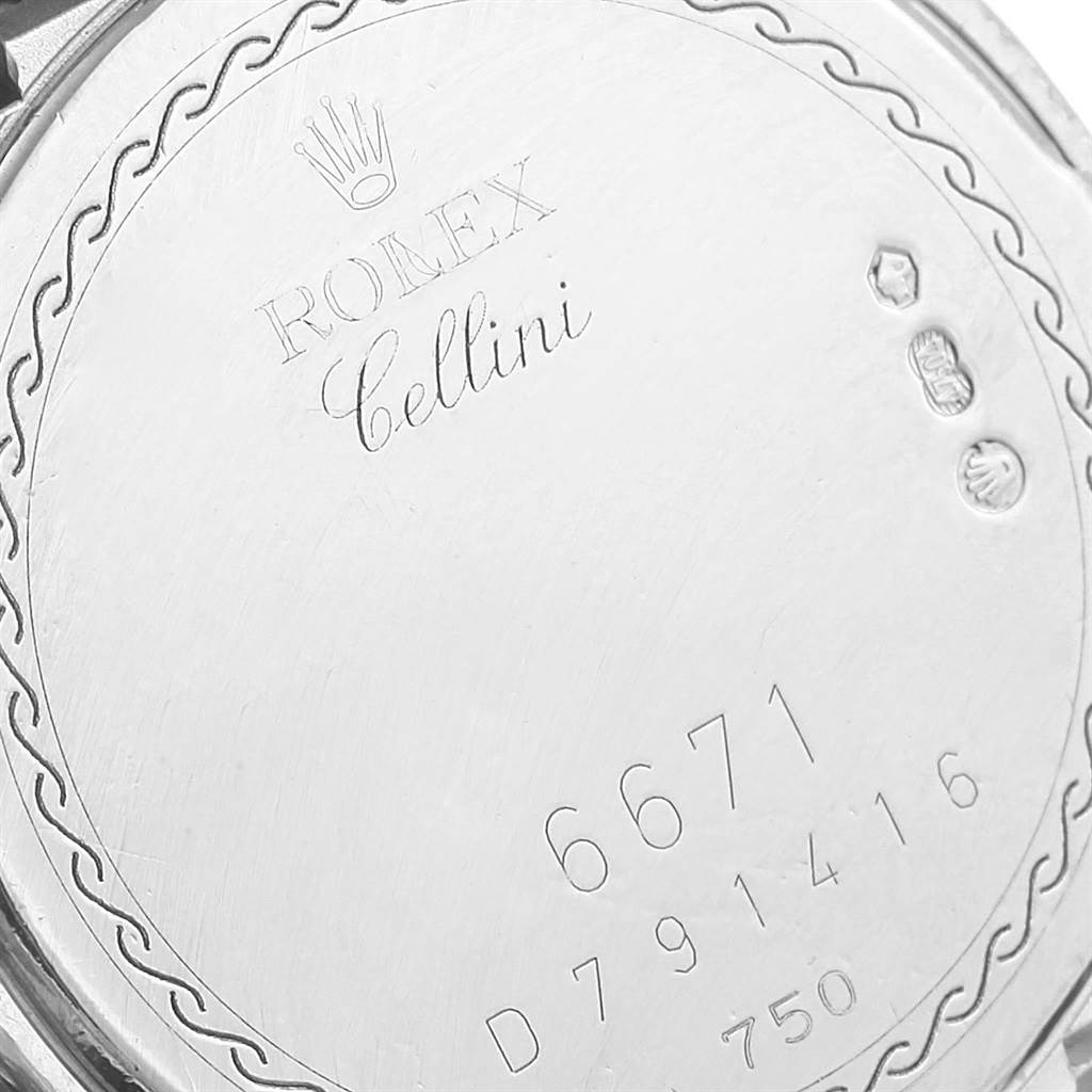 The image shows the engraved back case of a Rolex Cellini 6671 Women's White Gold Silver Dial 6671 Women's White Gold Silver Dial watch.
