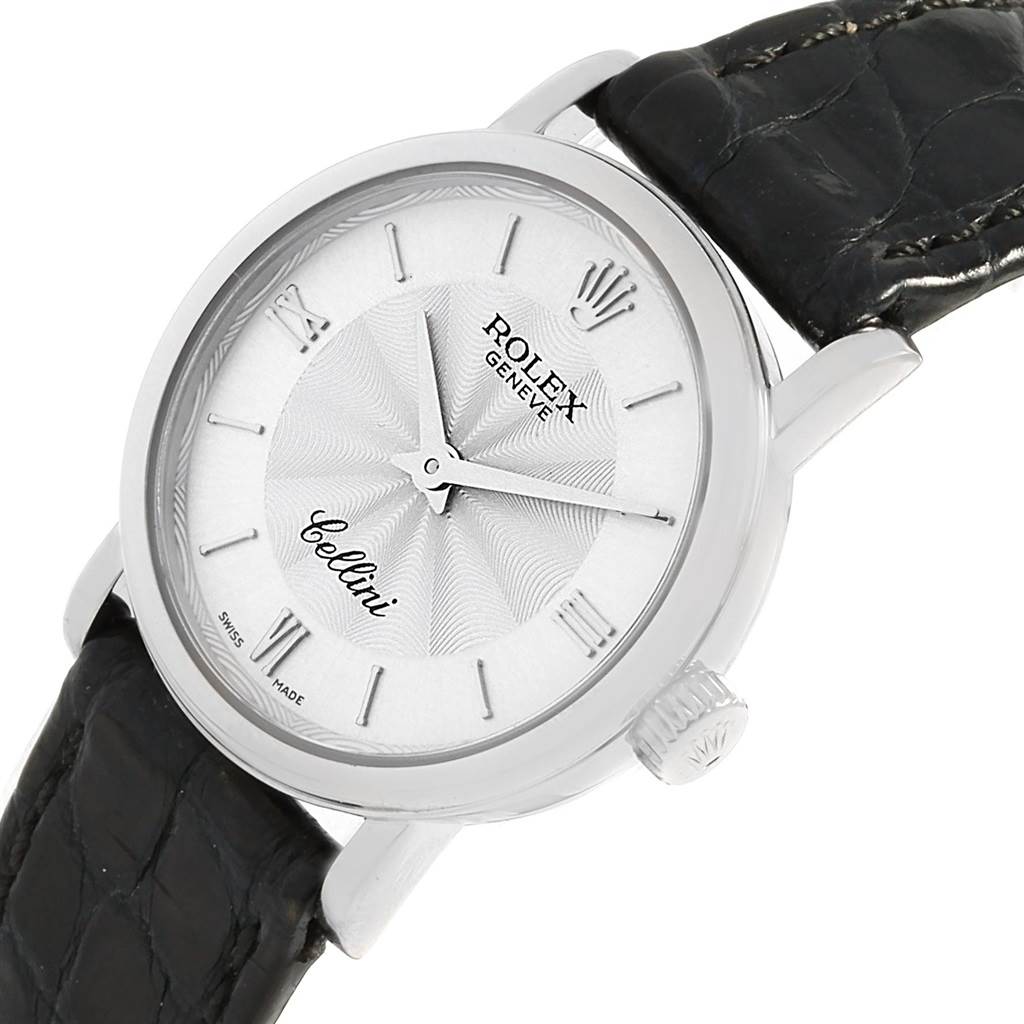 This image shows a close-up of a Rolex Cellini 6110 Women's White Gold Silver Dial 6110 Women's White Gold Silver Dial watch, highlighting the dial, crown, and part of the leather strap from a slight side angle.