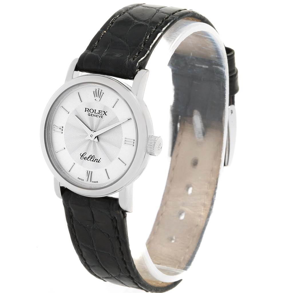 The image shows a Rolex Cellini 6110 Women's White Gold Silver Dial 6110 Women's White Gold Silver Dial watch at an angle displaying the face, crown, and black leather strap.