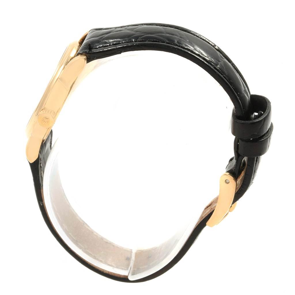 This image shows a profile view of the black leather strap and gold clasp of a Rolex Cellini 6111 Women's Yellow Gold Champagne Dial 6111 Women's Yellow Gold Champagne Dial watch.