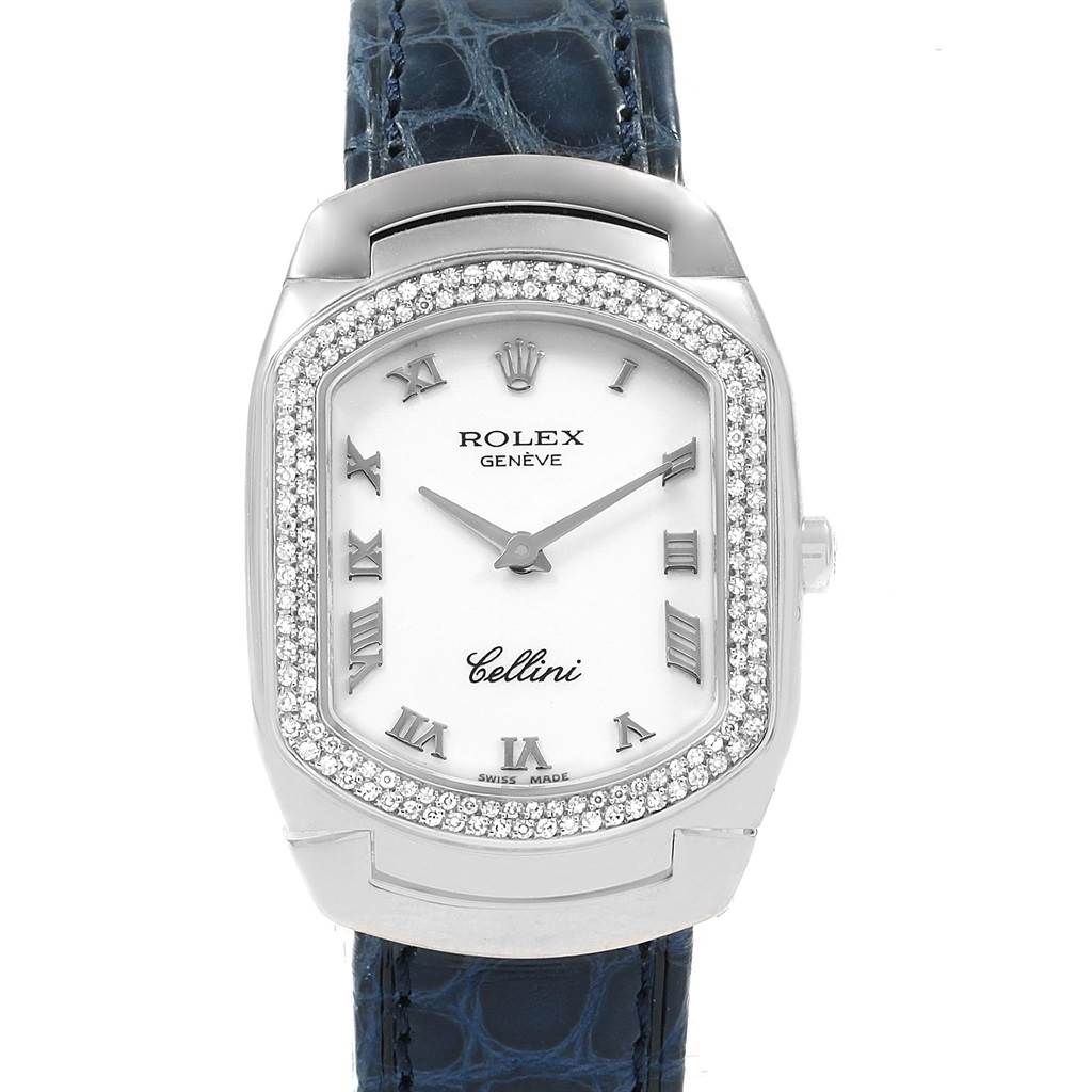 The image shows a frontal view of a Rolex Cellini 6691 Women's White Gold White Dial 6691 Women's White Gold White Dial watch, featuring a white dial, Roman numerals, diamond-encrusted bezel, and blue leather strap.