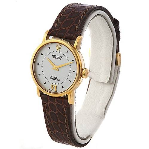The image shows a Rolex Cellini 6110 Women's Yellow Gold Silver Dial 6110 Women's Yellow Gold Silver Dial model watch angled slightly to the right, displaying its face, gold casing, and brown leather strap.
