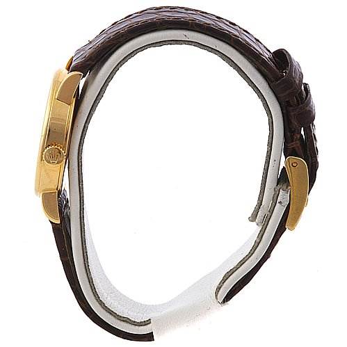 This side-angle view shows the case and brown leather strap of the Rolex Cellini 6110 Women's Yellow Gold Silver Dial 6110 Women's Yellow Gold Silver Dial model watch.