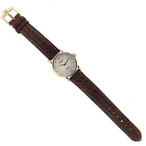 The image shows a Rolex Cellini 6110 Women's Yellow Gold Silver Dial 6110 Women's Yellow Gold Silver Dial watch with a round dial, gold case, and brown leather strap, viewed from a top-down angle.