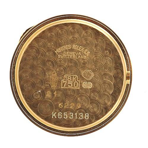 This image shows the inner case back of a Rolex Cellini 6229 Women's Yellow Gold White Dial 6229 Women's Yellow Gold White Dial watch, highlighting engravings such as the brand, material, and model number. 