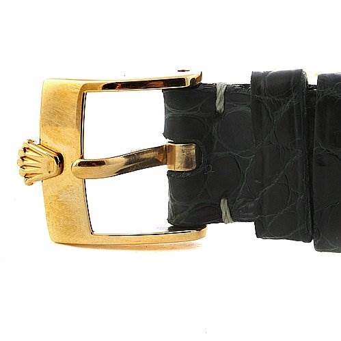 The image shows a side view of a Rolex Cellini 6229 Women's Yellow Gold White Dial 6229 Women's Yellow Gold White Dial watch's black leather strap and gold buckle with the Rolex crown logo.