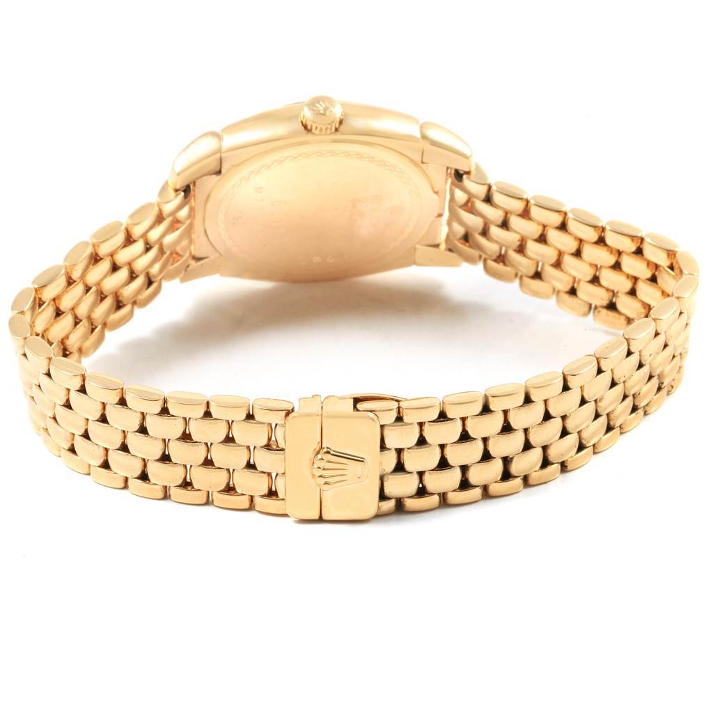 The image shows the back of a Rolex Cellini 6311 Women's Yellow Gold Champagne Dial 6311 Women's Yellow Gold Champagne Dial watch, highlighting its gold bracelet and clasp.