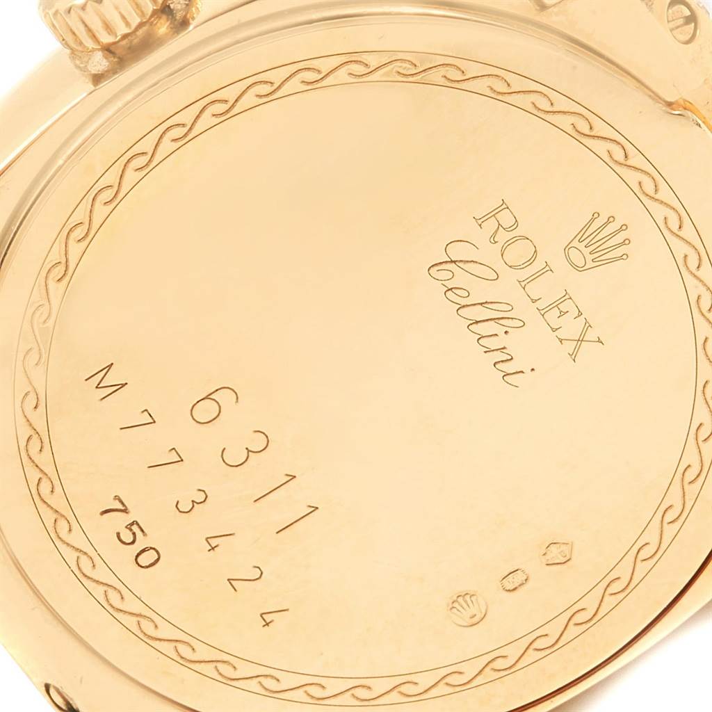 The image shows the engraved case back of a Rolex Cellini 6311 Women's Yellow Gold Champagne Dial 6311 Women's Yellow Gold Champagne Dial watch, highlighting the serial and model numbers.