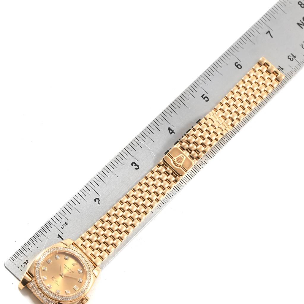 The image shows a Rolex Cellini 6311 Women's Yellow Gold Champagne Dial 6311 Women's Yellow Gold Champagne Dial watch laid flat, next to a ruler, highlighting its bracelet and clasp.