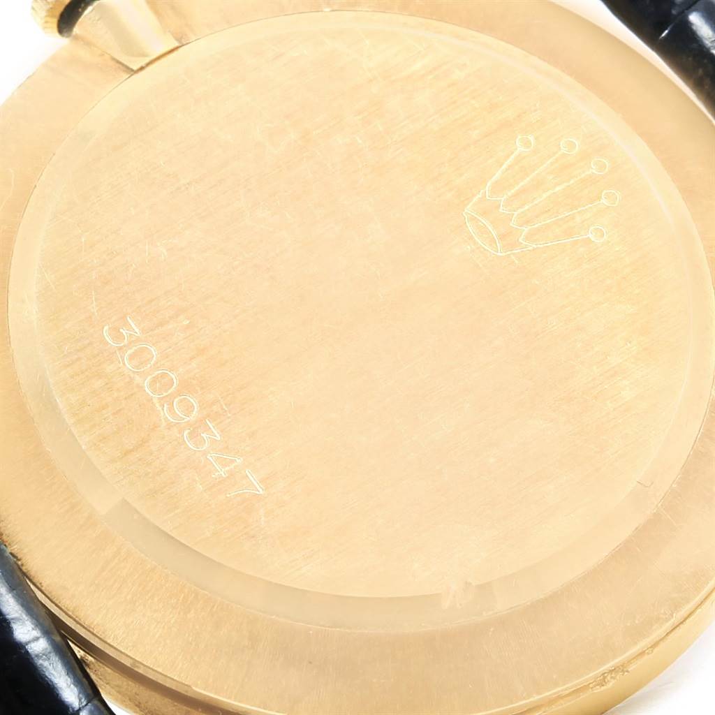 The image shows the back case of a Rolex Cellini 3833 Men's Yellow Gold White Dial 3833 Men's Yellow Gold White Dial watch, displaying part of the strap and the engraved serial number.