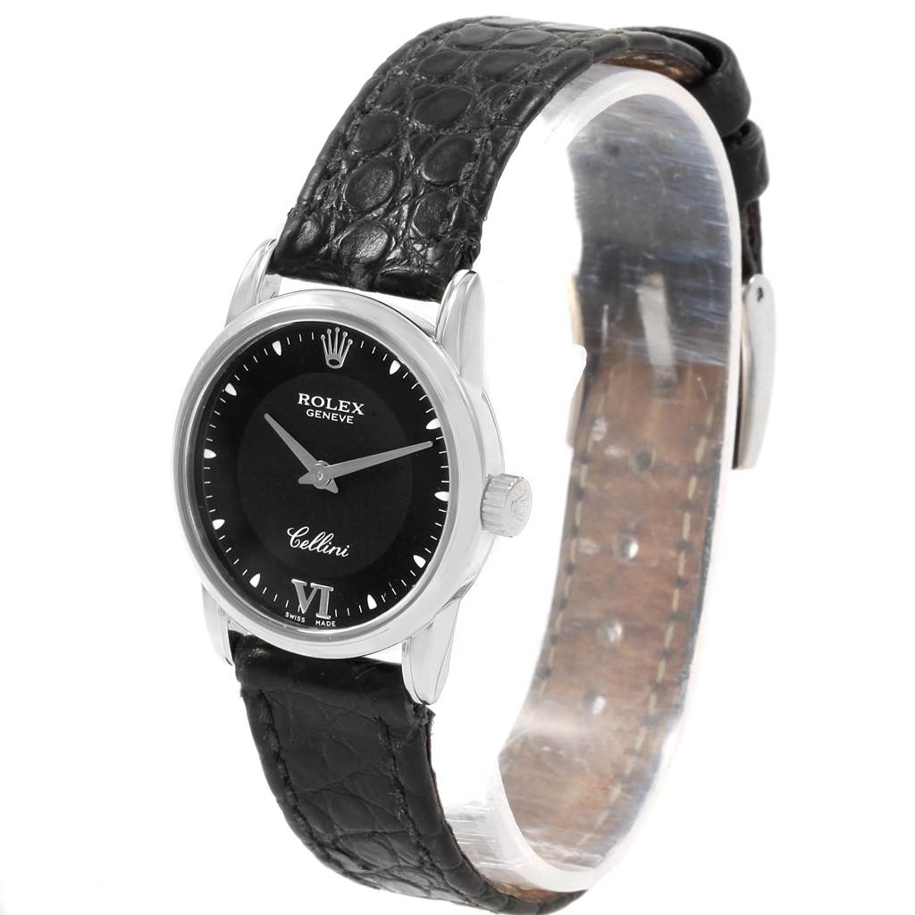 The Rolex Cellini 6111 Women's White Gold Black Dial 6111 Women's White Gold Black Dial watch is shown at a slight side angle, highlighting the black dial, crown, and leather strap.