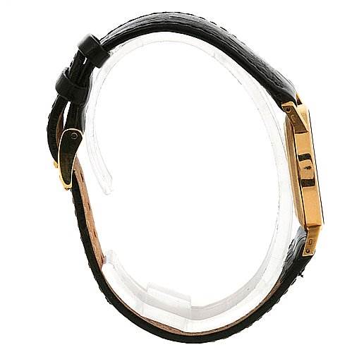 The image shows the side view of a Rolex Cellini 5109 Women's Yellow Gold Mother of Pearl Dial 5109 Women's Yellow Gold Mother of Pearl Dial watch, detailing its black leather strap and gold-tone case.