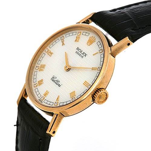 The image shows a side-angle view of a Rolex Cellini 5109 Women's Yellow Gold Mother of Pearl Dial 5109 Women's Yellow Gold Mother of Pearl Dial watch, highlighting its round gold case, crown, and leather strap.