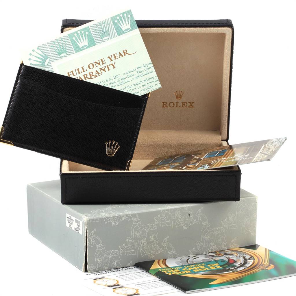 This image shows a Rolex Cellini 4233 Women's White Gold Black Dial 4233 Women's White Gold Black Dial watch box with warranty papers and a black leather card holder.
