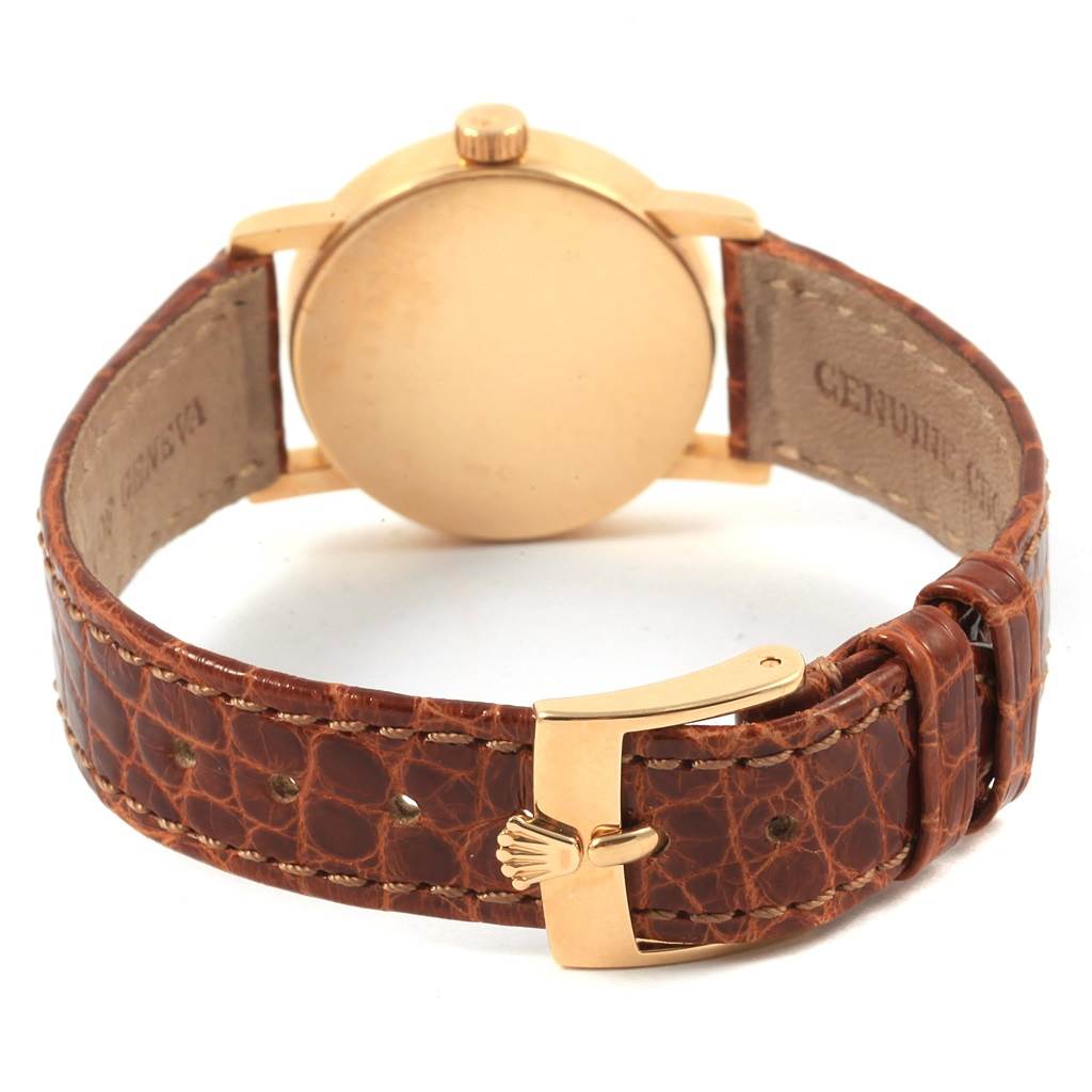 This image shows the back and buckle of the Rolex Cellini 6110 Women's Yellow Gold Silver Dial 6110 Women's Yellow Gold Silver Dial watch with a brown leather strap.