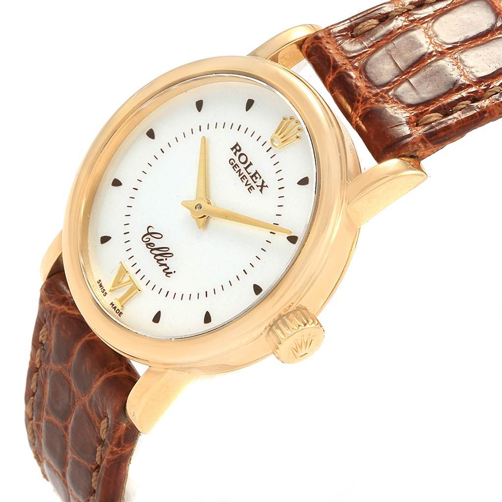 This image shows a Rolex Cellini 6110 Women's Yellow Gold Silver Dial 6110 Women's Yellow Gold Silver Dial watch at a three-quarter angle, highlighting its dial, crown, and brown leather strap.