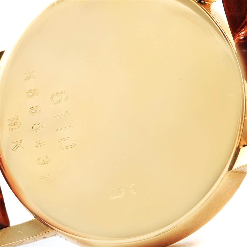 The image shows the back case of a Rolex Cellini 6110 Women's Yellow Gold Silver Dial 6110 Women's Yellow Gold Silver Dial watch, displaying the model number and gold purity marks.