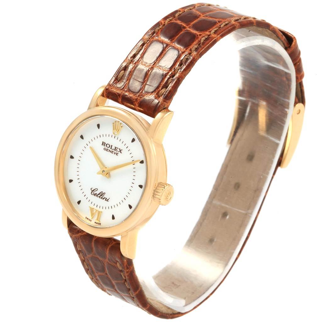 The image shows a side and top view of a Rolex Cellini 6110 Women's Yellow Gold Silver Dial 6110 Women's Yellow Gold Silver Dial watch with a round dial and a brown leather strap.