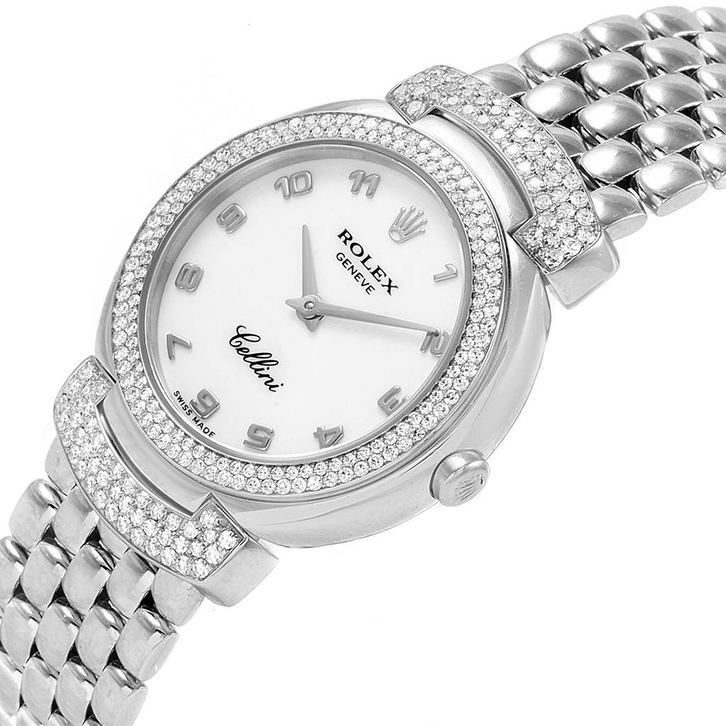 This image shows a Rolex Cellini 6673 Women's White Gold White Dial 6673 Women's White Gold White Dial watch from an oblique angle, highlighting its face, bezel, and part of its bracelet.