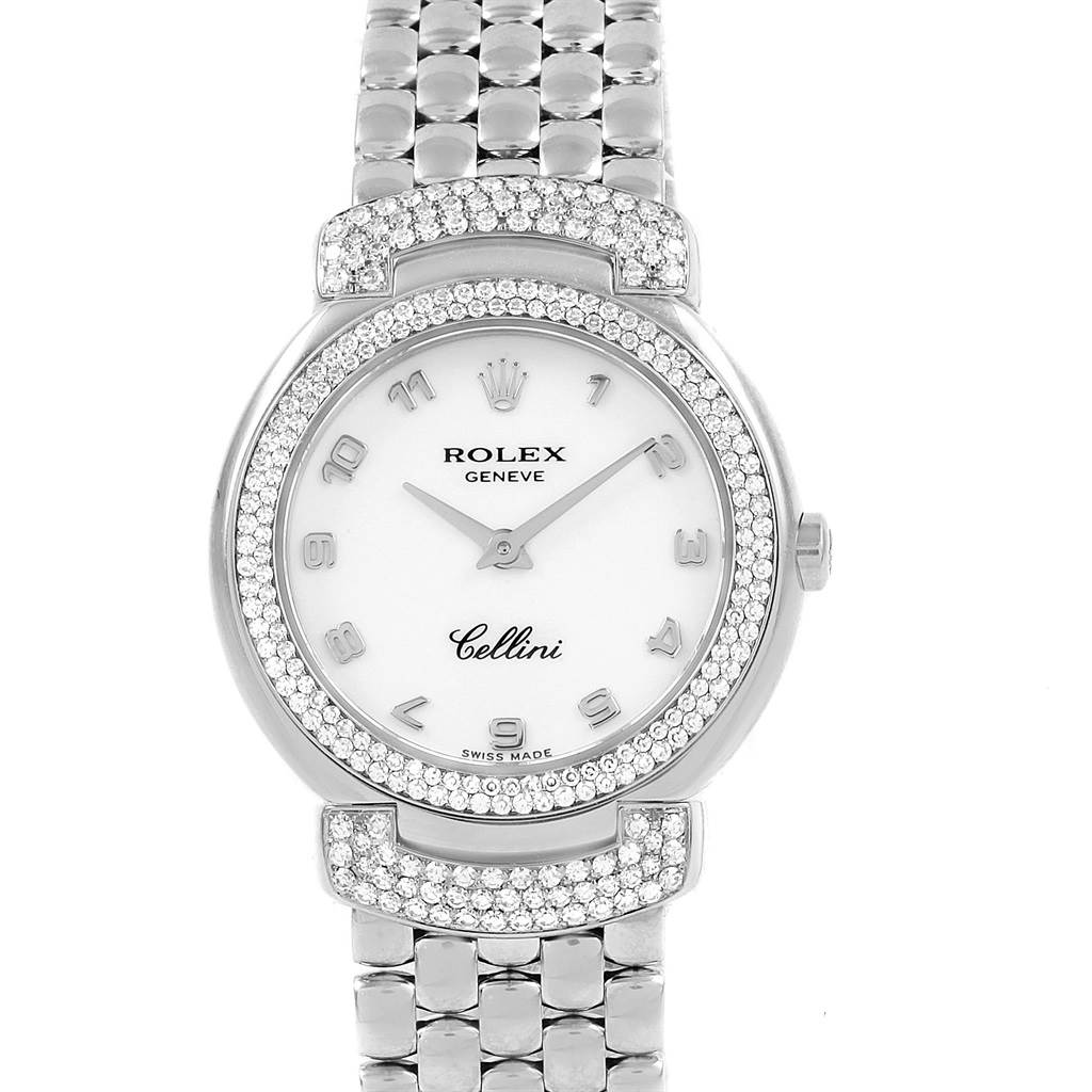 The Rolex Cellini 6673 Women's White Gold White Dial 6673 Women's White Gold White Dial watch is shown from a top-down angle, displaying the face, bezel, and part of the metallic strap.