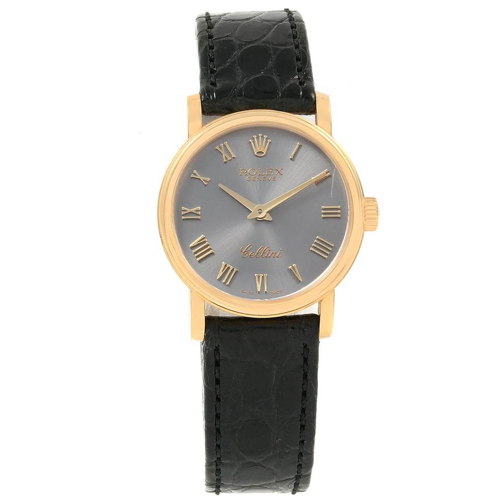 The Rolex Cellini 6110 Women
s Yellow Gold Grey Dial 6110 Women
s Yellow Gold Grey Dial watch is shown from the front, displaying its face, hands, and black leather strap.