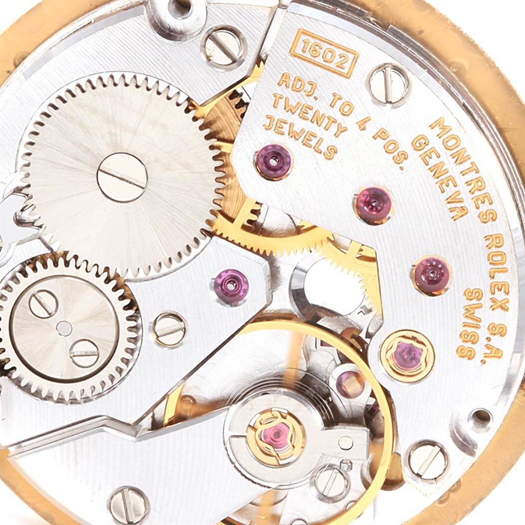 This image shows the intricate inner workings and gears of a Rolex Cellini 5109 Women's Yellow Gold White Dial 5109 Women's Yellow Gold White Dial model watch, viewed at close-up angle.