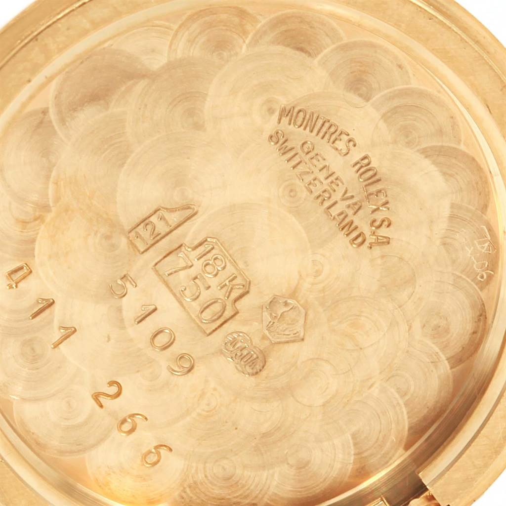 This close-up image shows the inside case back of a Rolex Cellini 5109 Women's Yellow Gold White Dial 5109 Women's Yellow Gold White Dial watch, highlighting its engravings and hallmarks.