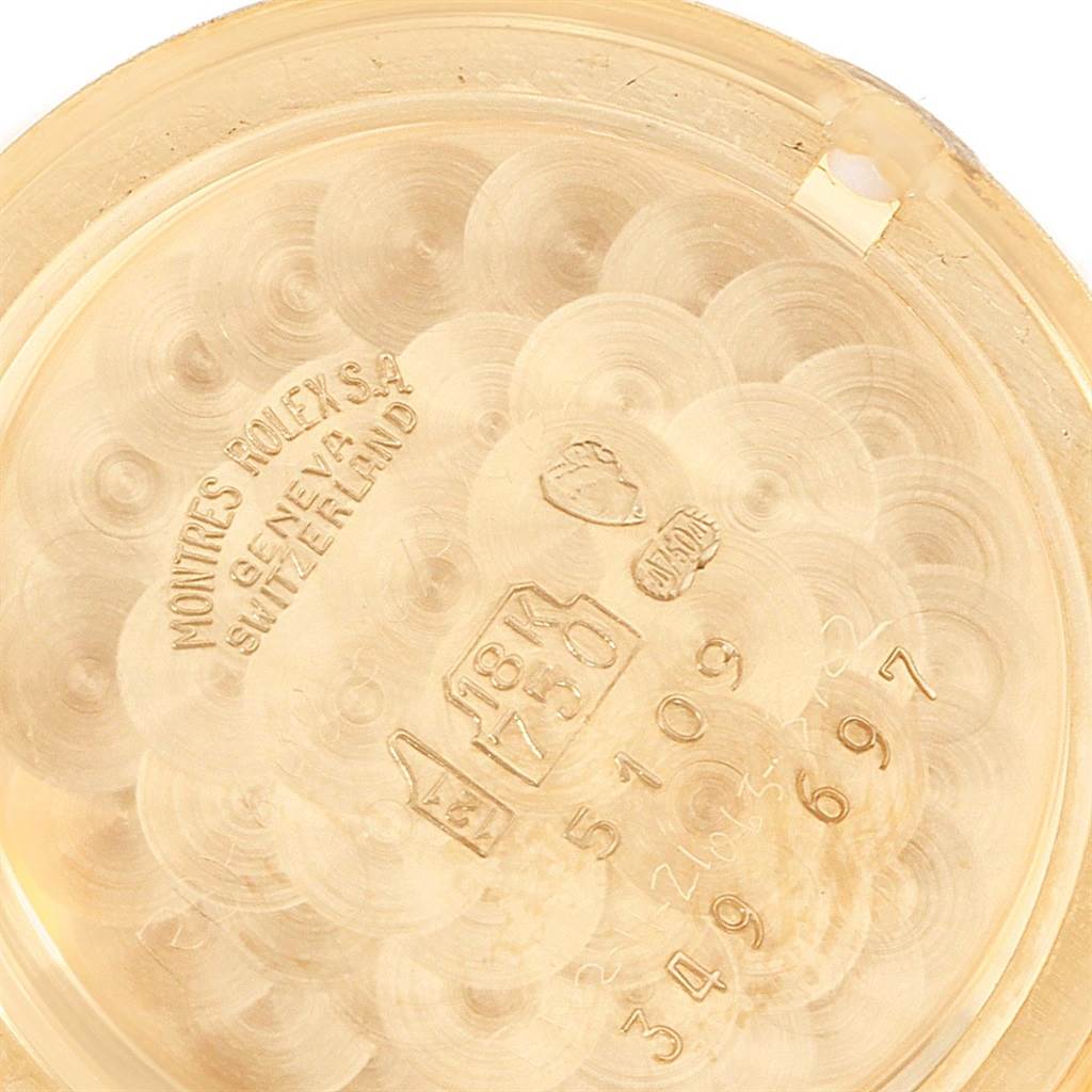 This image shows the inside of the Rolex Cellini 5109 Women's Yellow Gold Champagne Dial 5109 Women's Yellow Gold Champagne Dial model watchcase, highlighting inscriptions and hallmark stamps on the gold casing.