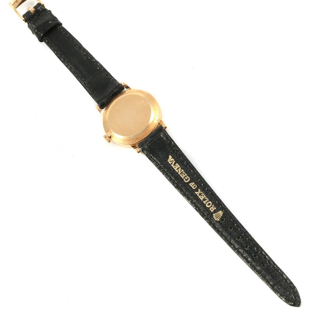 The image shows the back view of a Rolex Cellini 5109 Women's Yellow Gold Champagne Dial 5109 Women's Yellow Gold Champagne Dial watch, highlighting the case back and leather strap.