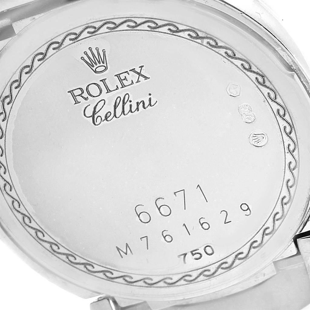 The image shows the inner case back of a Rolex Cellini 6671 Women's White Gold White Dial 6671 Women's White Gold White Dial watch, featuring model and serial numbers.