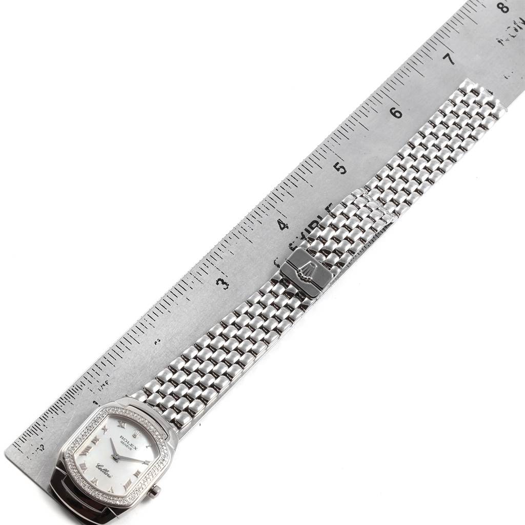 The image shows a Rolex Cellini 6691 Women
s White Gold Mother of Pearl Dial 6691 Women
s White Gold Mother of Pearl Dial watch with a silver bracelet and clasp, placed next to a ruler for scale.