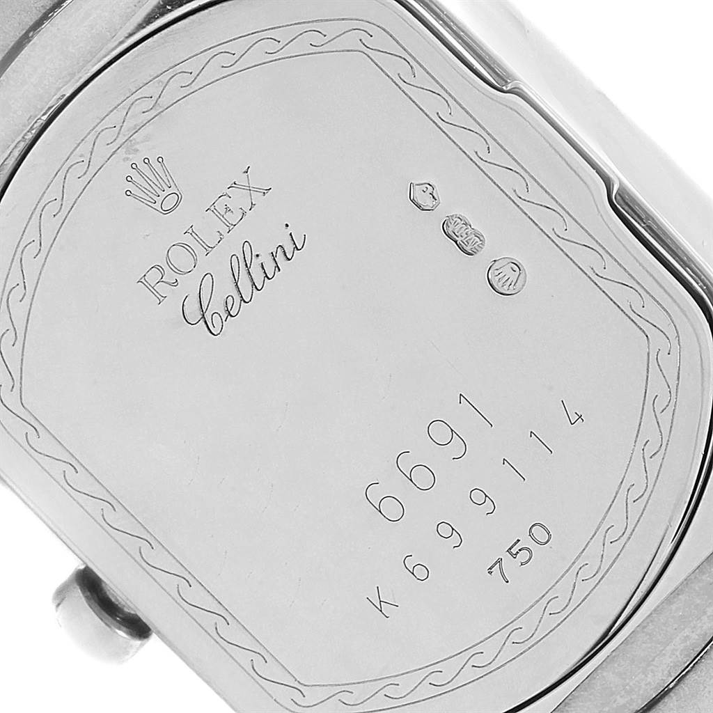 The image shows the back case of a Rolex Cellini 6691 Women
s White Gold Mother of Pearl Dial 6691 Women
s White Gold Mother of Pearl Dial watch with the model number and hallmark engravings.