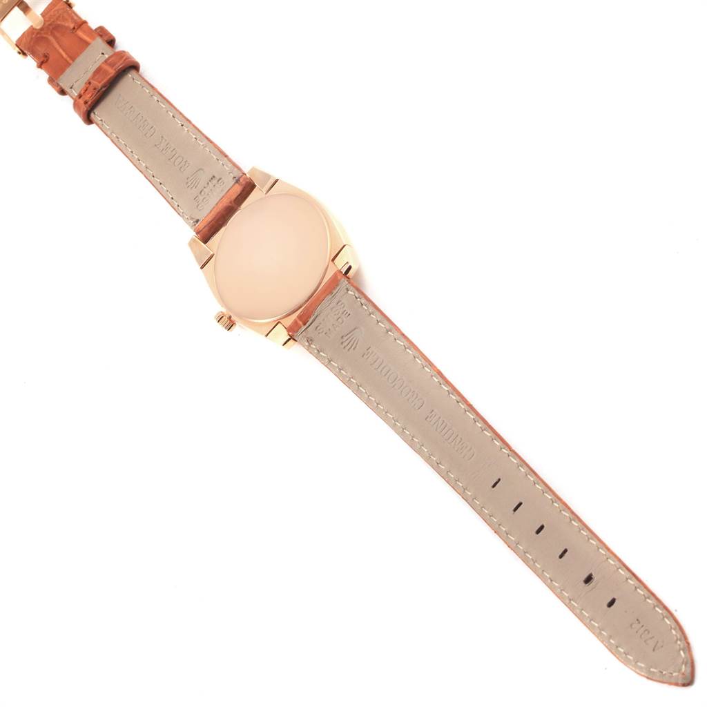 The image shows the underside of the Rolex Cellini 5310 Women's Rose Gold White Dial 5310 Women's Rose Gold White Dial watch, highlighting the strap and case back.