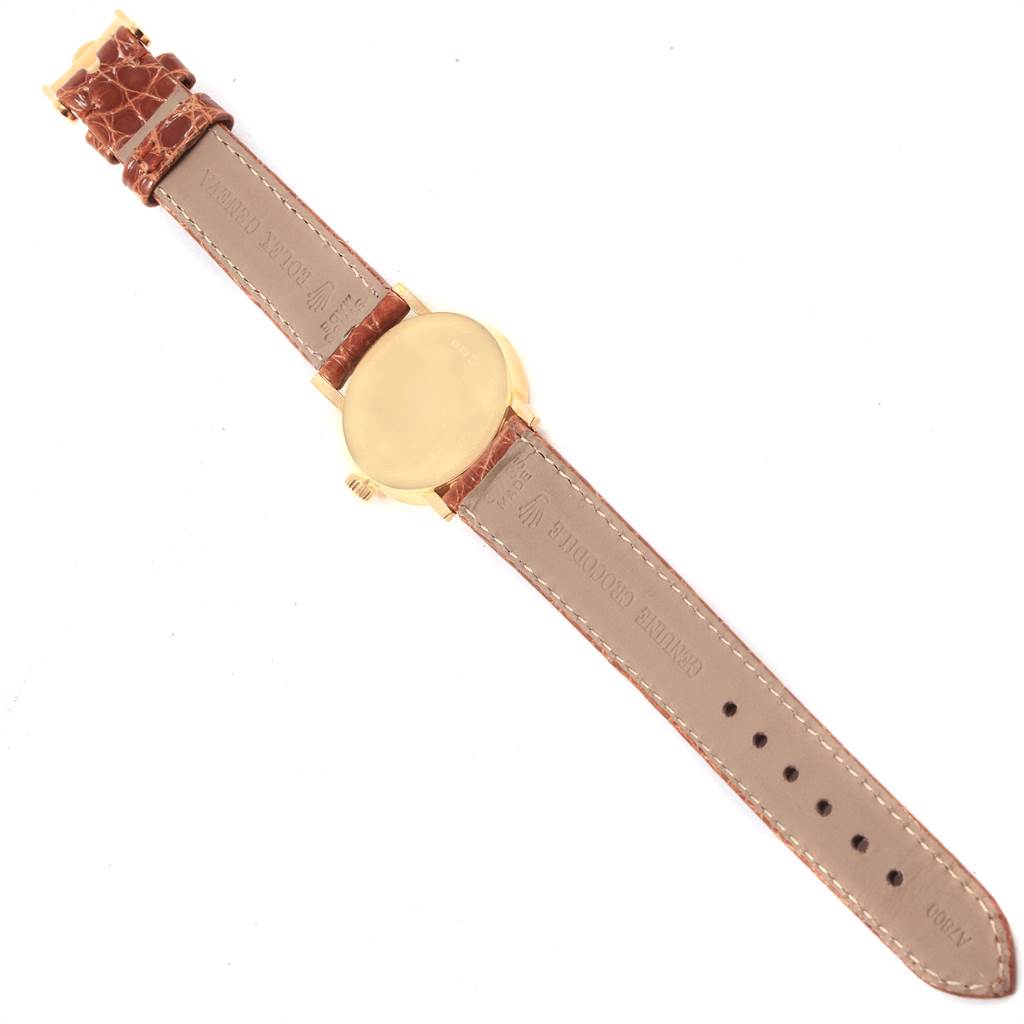 The image shows the back of a Rolex Cellini 6110 Women's Yellow Gold Beige Dial 6110 Women's Yellow Gold Beige Dial watch with its entire strap laid flat, displaying the case back and leather straps.