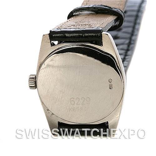 The image shows the back of a Rolex Cellini 6229 Women's White Gold White Dial 6229 Women's White Gold White Dial watch, highlighting the case back and part of the leather strap.