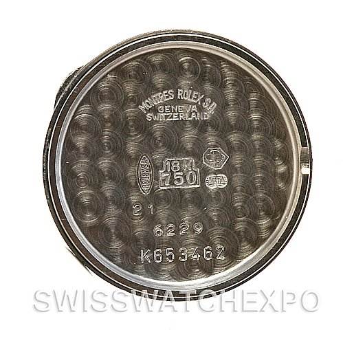 This image shows the inside case back of a Rolex Cellini 6229 Women's White Gold White Dial 6229 Women's White Gold White Dial watch, displaying markings and engravings indicating its authenticity and material.